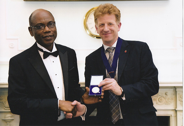 ThinkRox Inc Professor Fidelis Suorineni (Ph.D.) Fidelis Douglas Hay Medal Photo Ist Medal awarded in 2012 in London Britain | ThinkRox Inc. - Your Mining and Geomechanics Specialists